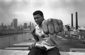 USA. Chicago, Ill. 1966. Muhammad ALI on a bridge overlooking the Chicago River and the city's skyline. (Photo Credit: © Thomas Hoepker/Magnum Photos)