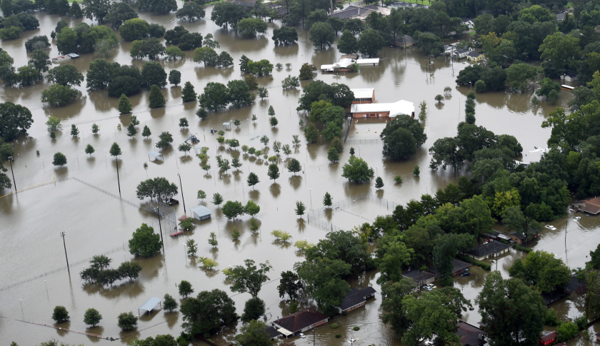 This aerial image shows flooded areas of North Baton Rouge, La., Saturday, Aug. 13, 2016. Louisiana Gov. John Bel Edwards says more than 1,000 people in south Louisiana have been rescued from homes, vehicles and even clinging to trees as a slow-moving storm hammers the state with flooding. (Patrick Dennis/The Advocate via AP)